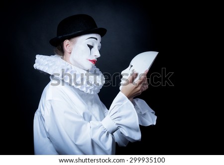 https://thumb1.shutterstock.com/display_pic_with_logo/919469/299935100/stock-photo-sad-mime-pierrot-looking-at-the-mask-299935100.jpg