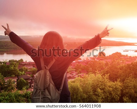 stock photo woman in front of beautiful scene of riverside in the sunrise morning 564011908