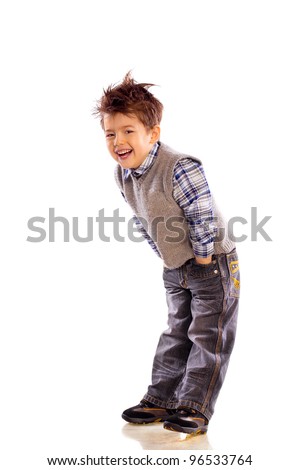 young European children laughing on white background in a knitted sweater and jeans