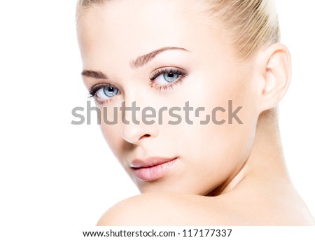 Portrait of beautiful young blond woman with clean face. High key shot.