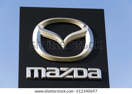 PRAGUE, CZECH REPUBLIC - MARCH 31: Mazda car company logo in front of dealership building on March 31, 2017 in Prague, Czech republic. Mazda set to launch new electric vehicle range by 2019.