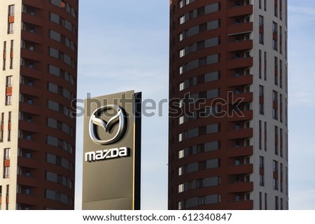 PRAGUE, CZECH REPUBLIC - MARCH 31: Mazda car company logo in front of dealership building on March 31, 2017 in Prague, Czech republic. Mazda set to launch new electric vehicle range by 2019.