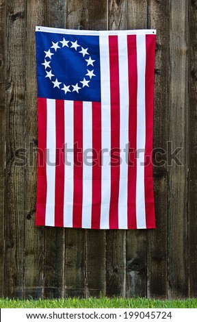 13 Star American Flag The Betsy Ross Displayed On Rustic Wooden Fence 13 Star American Flag The Betsy Ross Displayed On Rustic Wooden Fence