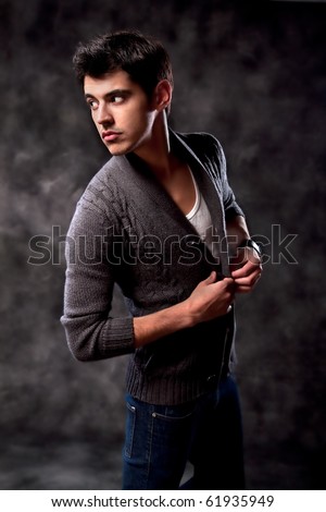Fashion Shot of a macho Man. A trendy European man dressed in contemporary cloth. He is now a professional model.