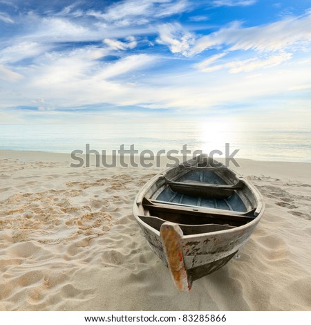 Boat on the beach at sunrise time