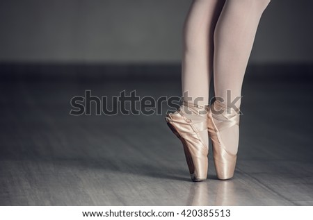 Ballet shoes. Detail shot of ballerina legs.