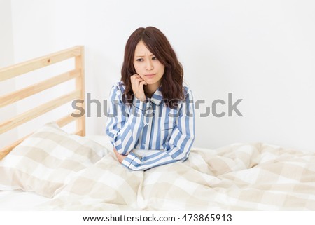 https://thumb1.shutterstock.com/display_pic_with_logo/947665/473865913/stock-photo-attractive-asian-woman-in-night-clothes-glum-473865913.jpg