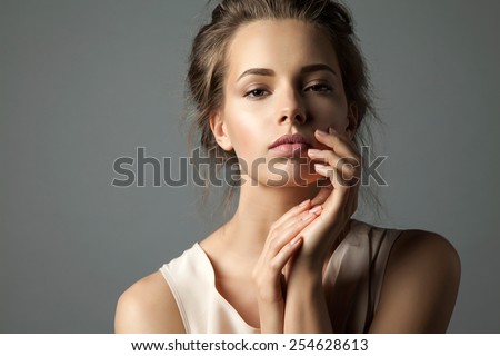 Portrait of a blonde young pretty woman with natural make-up