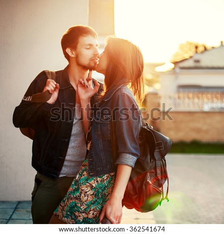 https://thumb1.shutterstock.com/display_pic_with_logo/952708/362541674/stock-photo-beautiful-young-kissing-couple-stylish-look-hipster-style-outdoor-summer-portrait-362541674.jpg