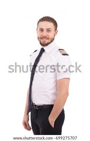 Happy beard pilot smiling and looking to you, guy wearing a pilot uniform, isolated on white background