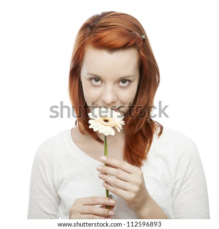 https://thumb1.shutterstock.com/display_pic_with_logo/958090/112596893/stock-photo-young-beautiful-red-haired-girl-smelling-on-a-flower-in-front-of-white-background-112596893.jpg