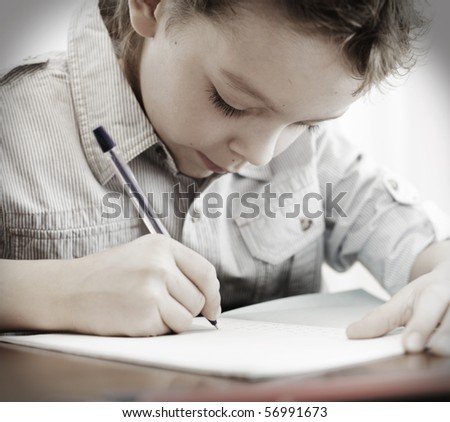 Little boy does a homework