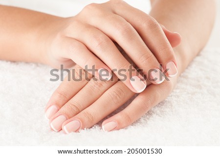 Beautiful hands on the white towel