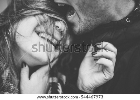 Lovely happy couple romantic black and white photo hugs together and smile Lovely happy couple romantic black and white photo hugs together and smile