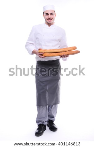 young baker isolated on white studio background holding a traditional bread french baguettes