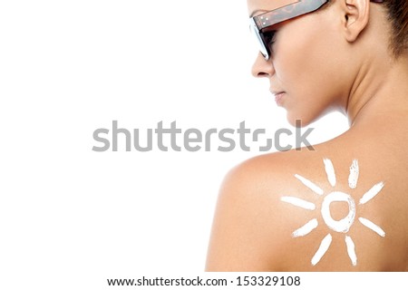 Rear view image of woman with <b>sun screen</b> lotion - stock-photo-rear-view-image-of-woman-with-sun-screen-lotion-153329108