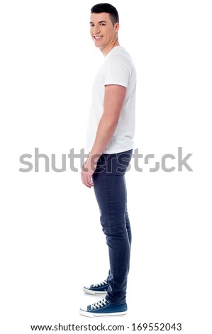 Man wearing white dress shirt standing sideways. Man wearing white dress shirt standing sideways.