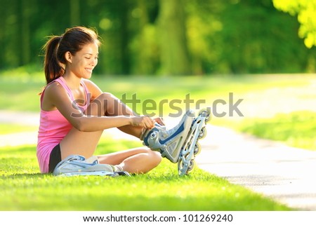 https://thumb1.shutterstock.com/display_pic_with_logo/97565/101269240/stock-photo-woman-skating-in-park-girl-going-rollerblading-sitting-in-grass-putting-on-inline-skates-mixed-101269240.jpg