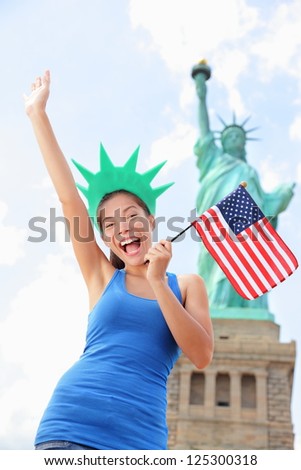 https://thumb1.shutterstock.com/display_pic_with_logo/97565/125300318/stock-photo-tourist-at-statue-of-liberty-new-york-usa-standing-with-american-flag-excited-and-happy-tourism-125300318.jpg