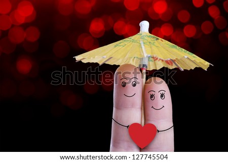 A smiling couple in love under the umbrella, valentines day