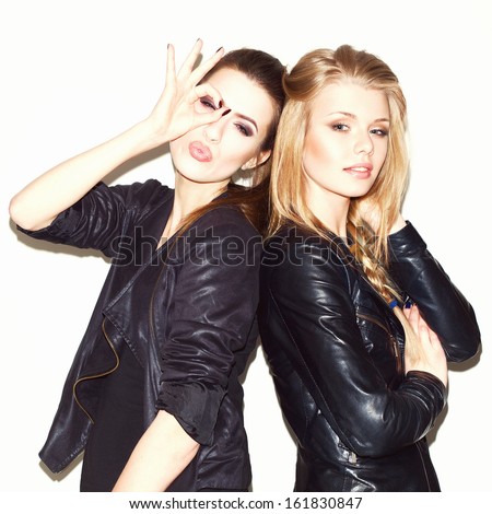 https://thumb1.shutterstock.com/display_pic_with_logo/990449/161830847/stock-photo-two-young-girl-friends-standing-together-brunete-having-fun-and-showing-sign-with-her-hand-161830847.jpg