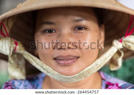CAN THO, VIETNAM, DECEMBER 11, 2014:Portrait of a woman selling soya milk in the covered Tan An market in Can Tho city, Vietnam.