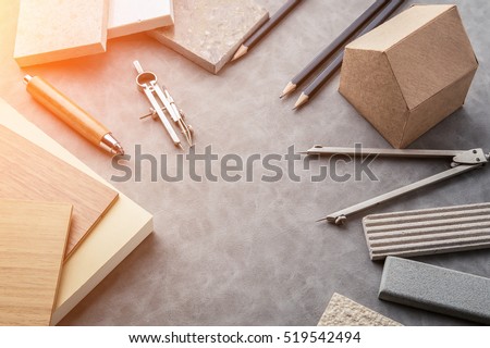 Top view of architects table with stuff of modern house with material sample on creative desk with free copyspace