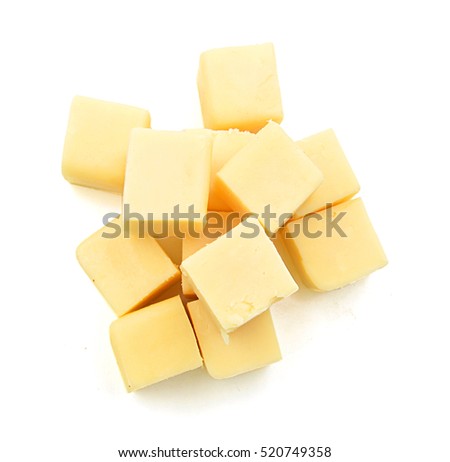 Cubes of cheddar cheese isolated on white