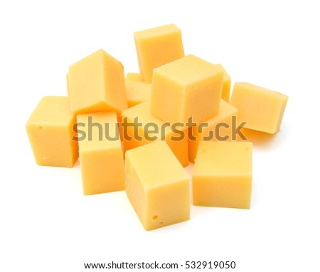 Cubes of cheddar cheese isolated on white