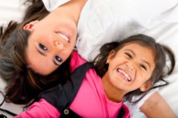 stock-photo-mother-and-daughter-smiling-isolated-over-a-white-background-42665092.jpg