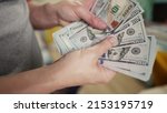 Small photo of dollar money. bankrupt man counting money cash. business crisis finance dollar concept. close-up of a hand counting paper dollars. exchange finance economy usd dollar pay tax