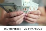 Small photo of dollar money. bankrupt man counting money cash. business crisis finance dollar concept. close-up of a hand counting paper dollars. exchange finance economy dollar lifestyle usd