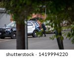 Small photo of Northridge, CA / United States - May 27, 2019: LAPD Patrol Units respond to brandishing/ADW call in suburban neighborhood with less lethal device. A LAPD officer is shown here with it.