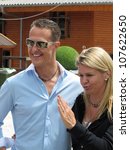 Small photo of GIVRINS, SWITZERLAND - JULY 14: Formula One racing driver Michael Schumacher with his wife Corinna during the CS CLASSIC 12 celebrity horse reigning event on July 14, 2012 in Givrins VD, Switzerland