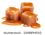 Caramel candies with caramel sauce isolated on a white background close up. 