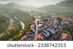 Small photo of Aerial shot of sunny slightly foggy morning in Veliko Tarnovo, Bulgaria. Flying over old houses, Ascension Cathedral and river in the canyon in Veliko Tarnovo 2