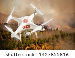 Fire Department Unmanned Aircraft System, (UAS) Drone Isolated Above a Forest Fire.
