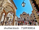 Small photo of Dubrovnik, Croatia - June 26, 2017 - Luza (Loggia) Square, the eastern end of the old town's main drag (Strada), with the City Bell Tower (Gradski zvonik) and Church of St. Blaise (Crkva sv. Blaza)