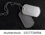 Small photo of Old and worn military dog tags - Blank