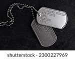 Small photo of Old and worn military dog tags