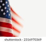Small photo of USA flag in bright sunlight with copy space for text. US American flag for 4th of July, Memorial Day, Veteran's Day, or other patriotic celebration.