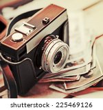 Old Retro Camera On Vintage...