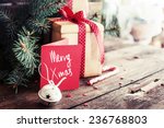 Christmas present on dark wooden background in vintage style 