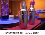 An image of cocktail shakers at an upscale bar