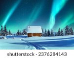 A picturesque winter tableau showcasing a wooden cottage and snow-covered conifers in the mountains. Aurora borealis. Northern lights in winter forest. Christmas holiday and winter vacations concept