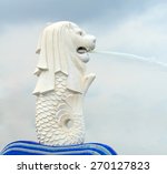Small photo of Merlion statue, Singapore. It is a mythical creature with the head of a lion and the body of a fish and used to personify Singapore.