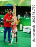 Small photo of RIO DE JANEIRO, BRAZIL - AUGUST 9, 2016: USA Gymnastics coach Valeri Liukin and Olympic champion Madison Kocian of USA during competition women's team all-around gymnastics at Rio 2016 Olympic Games