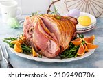 Small photo of Traditional Easter ham spiral sliced with honey glaze stuffed with oranges and rosemary