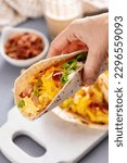 Small photo of Breakfast tacos with hash browns, scrambled eggs, cheese and bacon