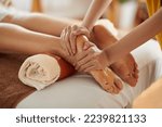 Woman getting relaxing feet massage with oils after long day